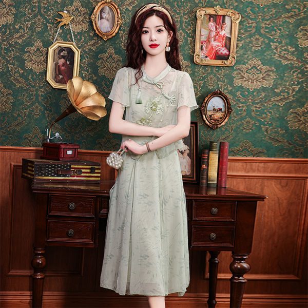 Side view of embroidered qipao top and skirt set for women